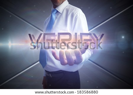Businessman presenting the word verify against futuristic screen with lines
