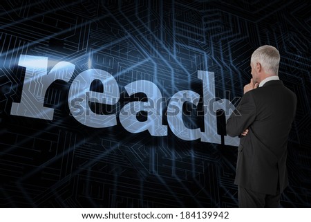 The word reach and thoughtful businessman standing back to camera against futuristic black and blue background