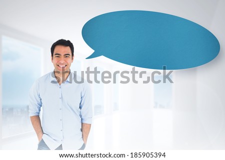 Smiling casual man standing with speech bubble against bright white hall with columns