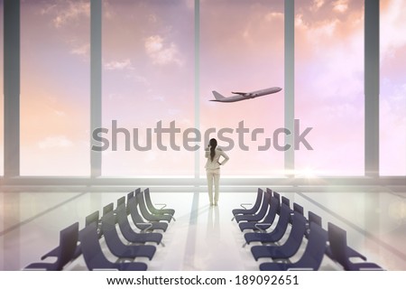 Thinking businesswoman against airport departure area