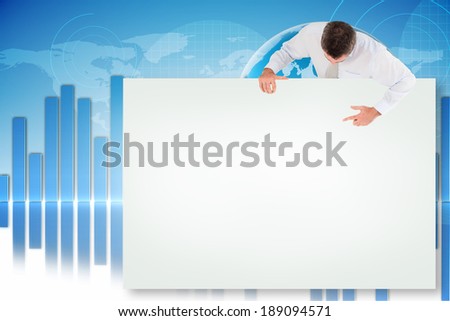 Composite image of businessman showing white card