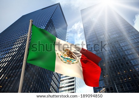Mexico national flag against low angle view of skyscrapers