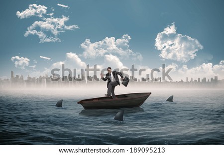 Happy businessman in a hury against sharks circling a small boat in the sea