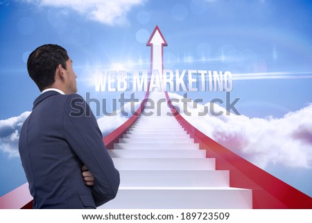 The word web marketing and unsmiling asian businessman with arms crossed against red steps arrow pointing up against sky