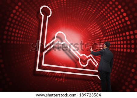 Composite image of graph and businessman pointing against red pixel spiral