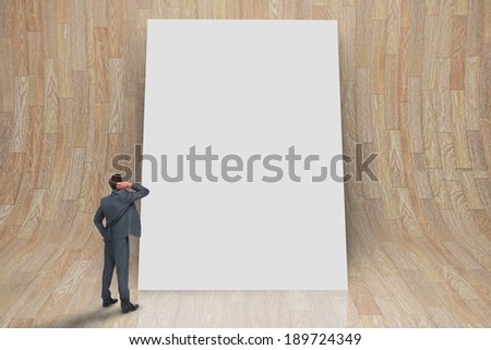 Composite image of thinking businessman against white card