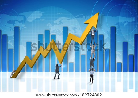 Business team holding up arrow against global business graphic in blue
