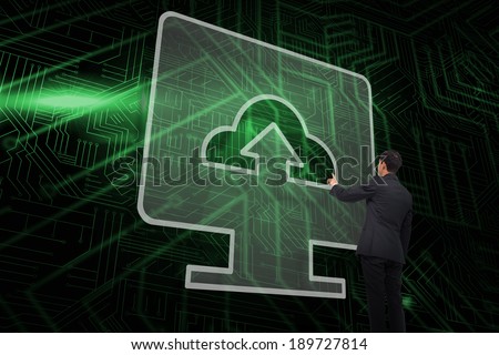 Composite image of computer screen and businessman pointing against green and black circuit board
