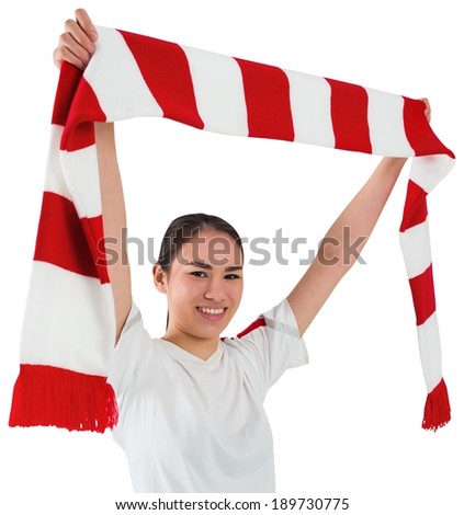 Football fan waving red and white scarf on white background