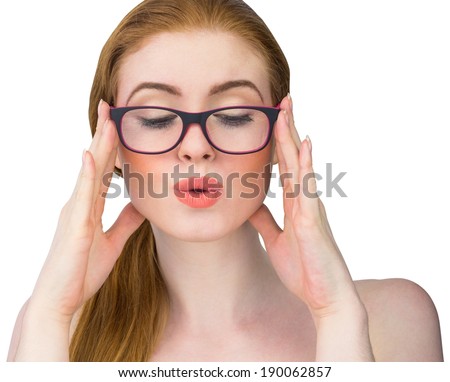 Beautiful redhead posing with glasses on white background