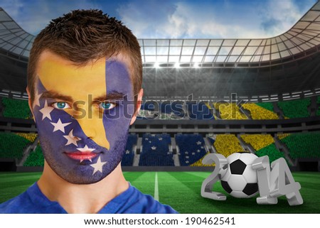 Serious young manComposite image of serious young bosnia fan with face paint against large football stadium with brasilian fans