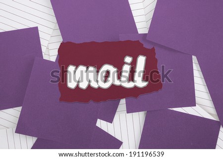 The word mail against purple paper strewn over notepad