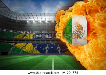 Composite image of fire surrounding mexico flag football against large football stadium with brasilian fans