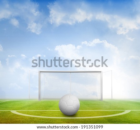 Digitally generated white leather football against football pitch under blue sky