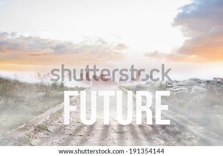 The word future against stony path leading to misty city horizon