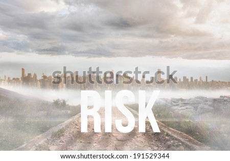 The word risk against stony path leading to large urban sprawl
