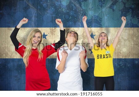 Composite image of various football fans against honduras flag in grunge effect