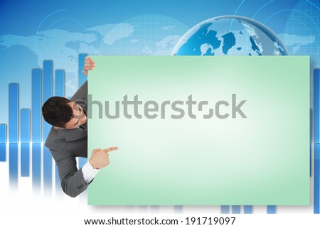 Composite image of businessman showing green card