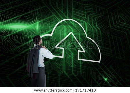 Composite image of cloud computing and businessman looking against green and black circuit board