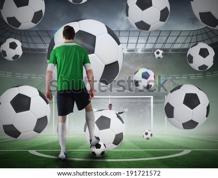 Composite image of football player about to take a penalty against football pitch in large stadium