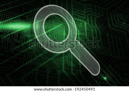 Magnifying glass against green and black circuit board