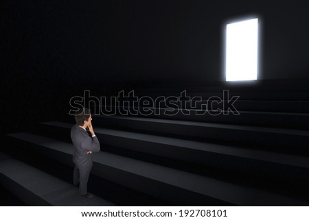 Thinking businessman touching his chin against steps leading to light in the darkness
