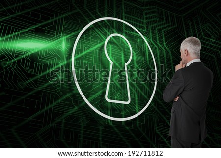 Composite image of keyhole and businessman looking against green and black circuit board