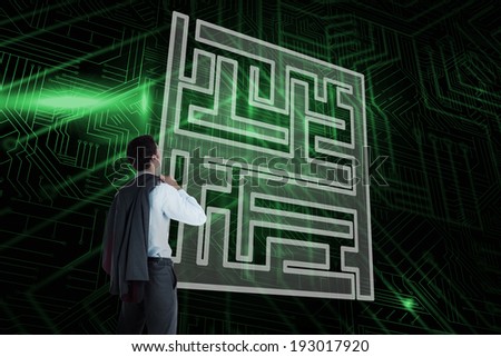 Composite image of maze and businessman looking against green and black circuit board
