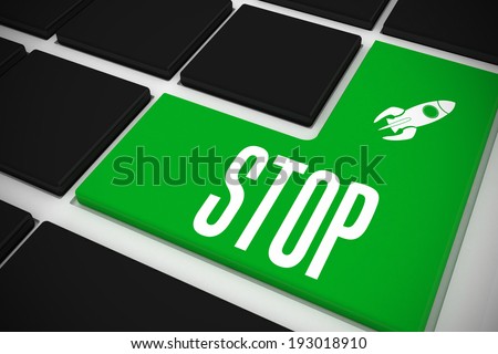 The word stop and rocket ship on black keyboard with green key