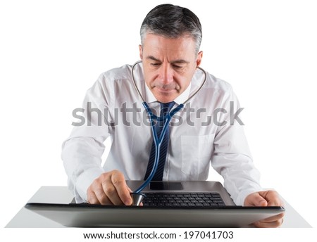 Mature businessman running diagnostics on laptop on white background