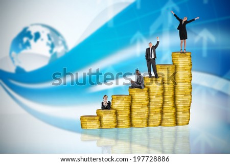 Composite image of business people on pile of coins against global business graphic in blue