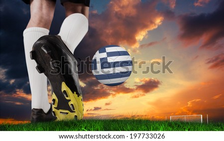 Composite image of football boot kicking greece ball against green grass under dark blue and orange sky