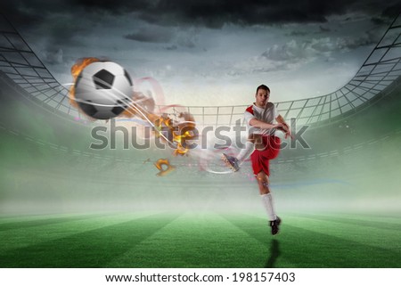 Football player in white kicking against misty football stadium under spotlights