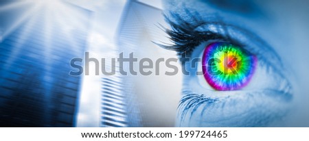 Pyschedelic eye on blue face against low angle view of skyscrapers