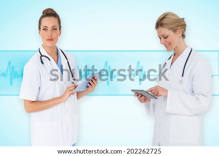 Composite image of female medical team against medical background with blue ecg line