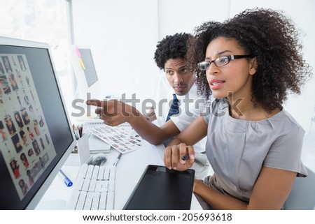 Young editorial team working together in her office