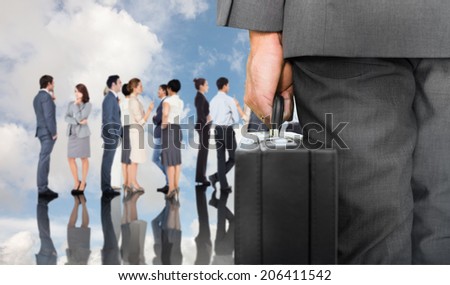 Businessman holding briefcase against blue sky with white clouds and business people
