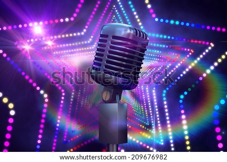 Retro chrome microphone against digitally generated star laser background