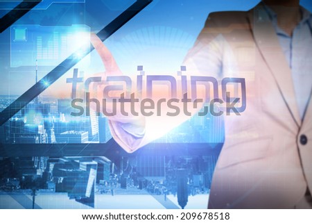 Businesswoman presenting the word training against room with large window looking on city