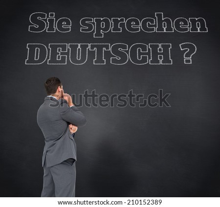 Composite image of thinking businessman against blackboard, Do you speak German?