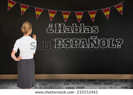 Thinking businesswoman against blackboard on wall, Do you speak Spanish?