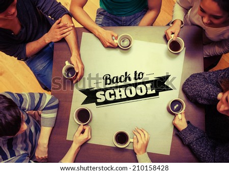 People sitting around table drinking coffee against back to school message
