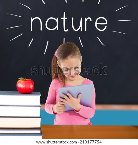 The word nature and cute girl using tablet against red apple on pile of books in classroom