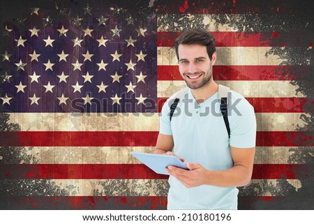 Student using tablet pc against usa flag in grunge effect