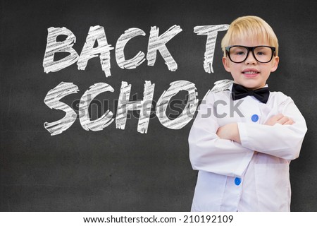 Cute pupil dressed up as teacher against black wall with back to school message