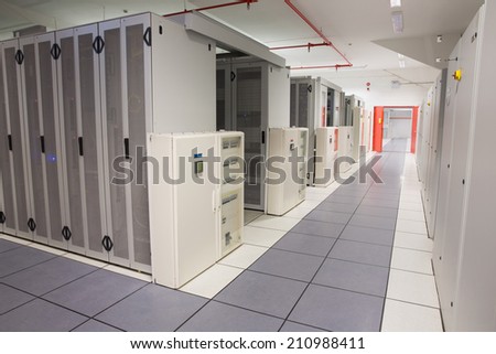 Empty hallway of server towers in large data center