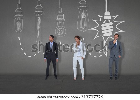 Composite image of business people standing against black wall
