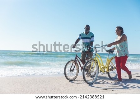 Similar – Foto Bild mit dem fahrrad am strand