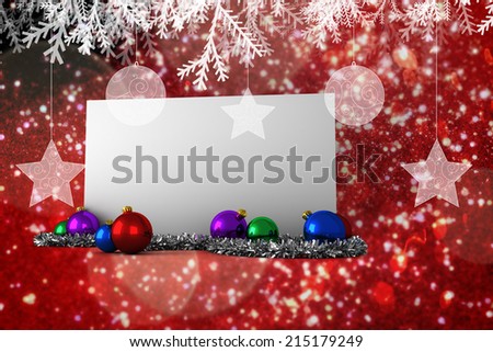 Composite image of poster with baubles against white snow and stars on red