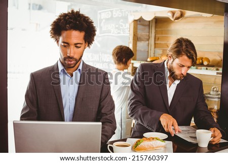 Businessmen enjoying their lunch hour at the coffee shop